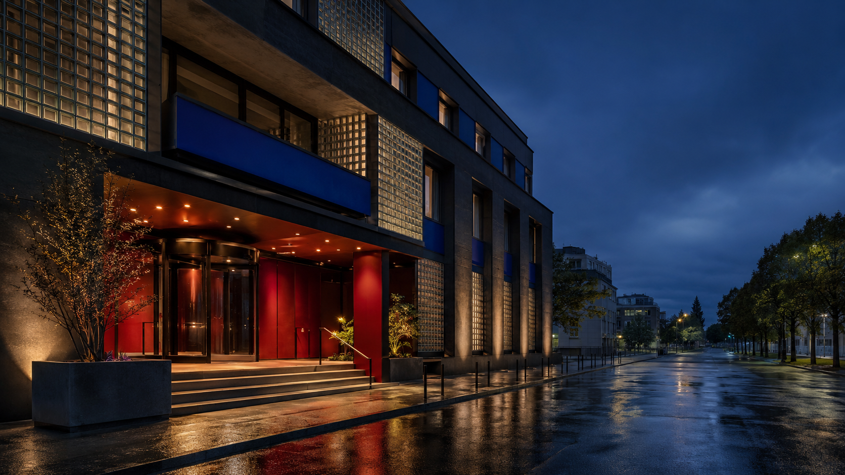 Contemporary Australian coastal hotel with sandstone terraces, native trees and an infinity pool at sunset